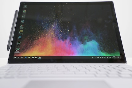  The optional pen can be magnetically attached to the left side of the display.