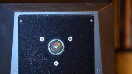 Pointing a torch at the loudspeaker dome can help find the right position.