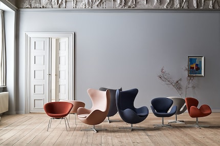 The chairs and armchairs are available in various muted colours.