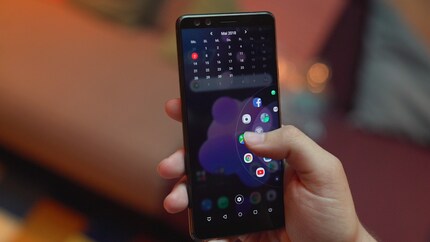 A double-click at the bottom right-hand side opens an app carousel. This is very handy when you only have one hand free.