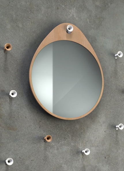 Hiding behind this mirror is a handy storage space. Image: Rizz