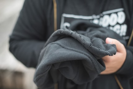 Holes formed by sparks following an experiment with metal.