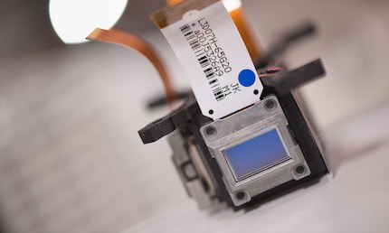 The blue light passes through this LCD panel and creates the blue image.