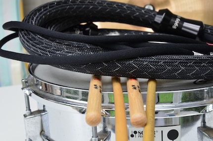 Some very expensive cables have diameters much larger than drumsticks.