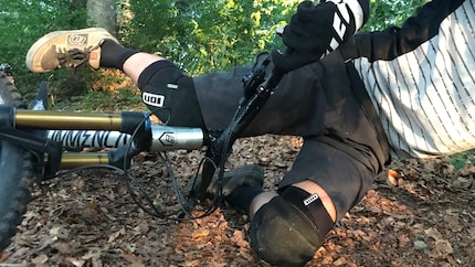 Physics in practice: The protector absorbs the energy by deforming on impact. The knee (hopefully) remains intact.