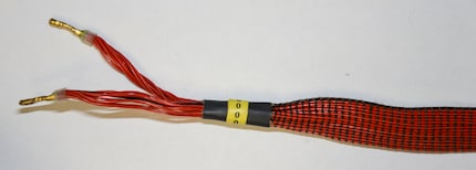 Flat cable with many parallel wires, in turn for the positive and negative poles, connected at the end.