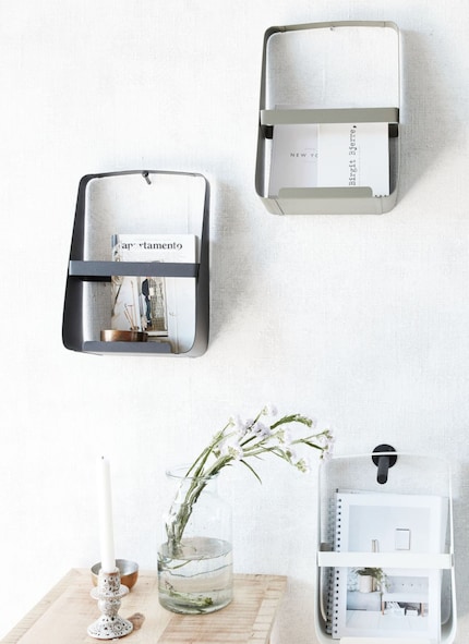Wall-mounted magazine holders make space on the floor and are a great way to display magazine covers. Image: House Doctor