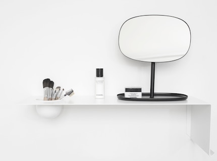 White accessories and furniture simulate a large home. Image: Nichba Design