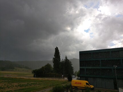 Overexposed clouds where details are lost. The house facade is far too dark