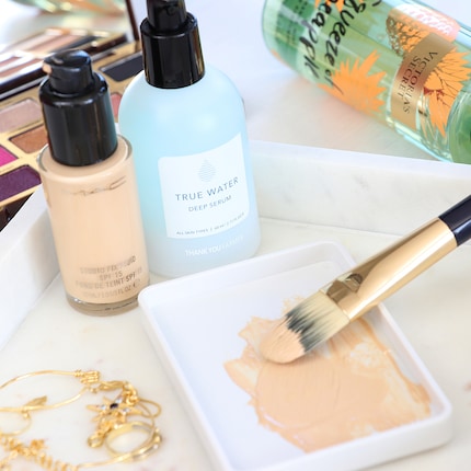 Either mix the serum into your foundation in a container