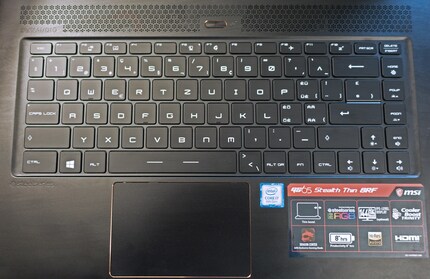 1.4 mm key travel and freely configurable RGB lighting. The image shows a Swiss keyboard.