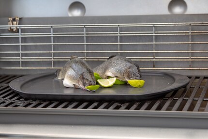 The two small chars sit on top of half and are placed on the grill.