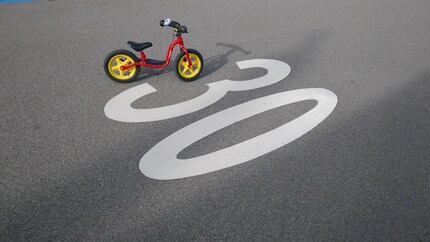 On limited areas in low-traffic side streets, play is permitted under supervision.