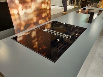 Induction cooker with built-in extractor hood. Nice indeed.