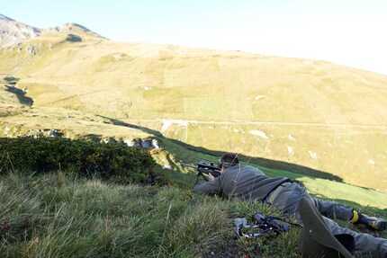 In position, finger outstretched.