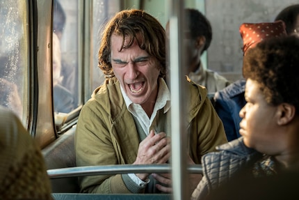  Forever alone in the middle of the crowd, Arthur Fleck aka the Joker looks for something to hold onto.