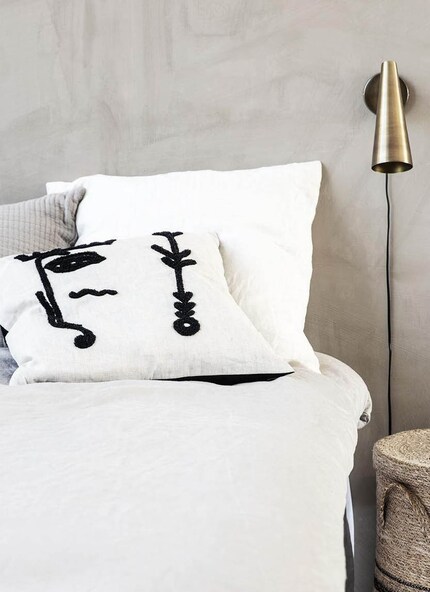 With a little imagination, you can see half of a face on the left-hand side of the cushion. Image: House Doctor