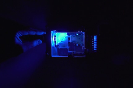 Here, a blue laser module would be useless, as the mirror does not allow the blue spectral components to pass through to the lens.