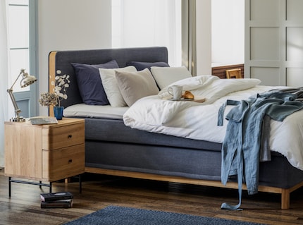 A box-spring bed looks elegant and offers comfort thanks to several layers. Image Pfister