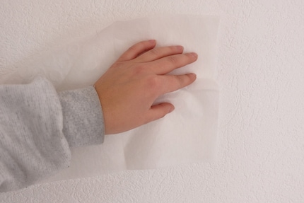 I dust off the place where I'm sticking the fasteners.