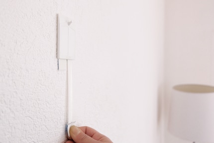 The adhesive strips on both models are easily removed.