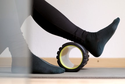 The body weight is rolled back and forth on the roller under constant pressure.