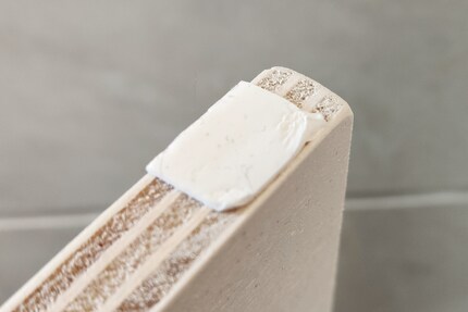 I stick the mounting tape to the wood at intervals of around five centimetres.