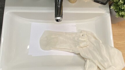 While the hairspray dries, I leave my wet blouse in the sink. After 15 minutes, the stain is actually gone.