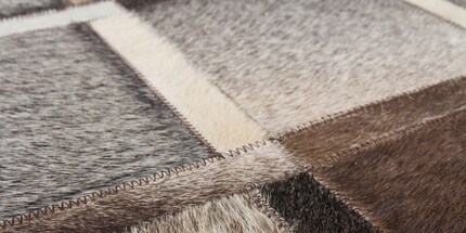 Leather is an exclusive but delicate carpet material.