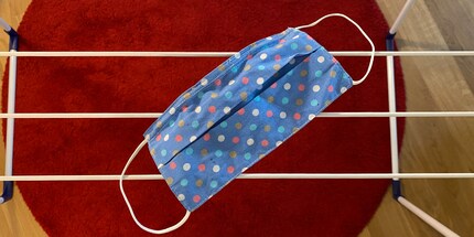 The best and most gentle way to dry your cloth mask is to lay it on a drying rack.