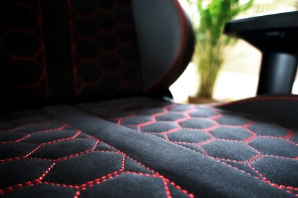 Decorative stitching – hexagonal, in some places – makes the chair look cool.