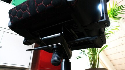 Two levers and a knob to adjust the height as well as to lock and adjust the tension of the tilt mechanism.