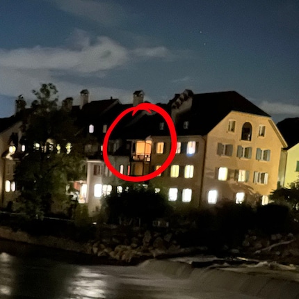 iPhone 13 Mini with the illuminated balcony.