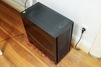 Unglamorously, the finished PC has its place on the floor next to the desk.