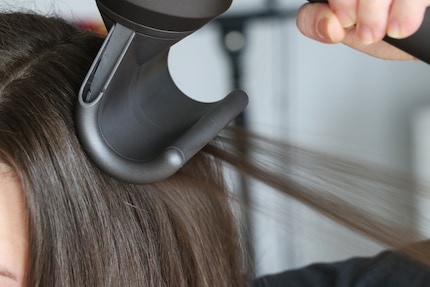 The top layer of hair curves along the surface.