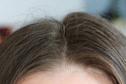 Zero styling. Hairs sticking up all over and an asymmetrical hairline.