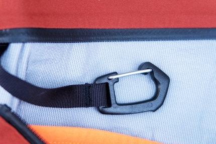 ... with integrated carabiner for the avalanche transceiver.