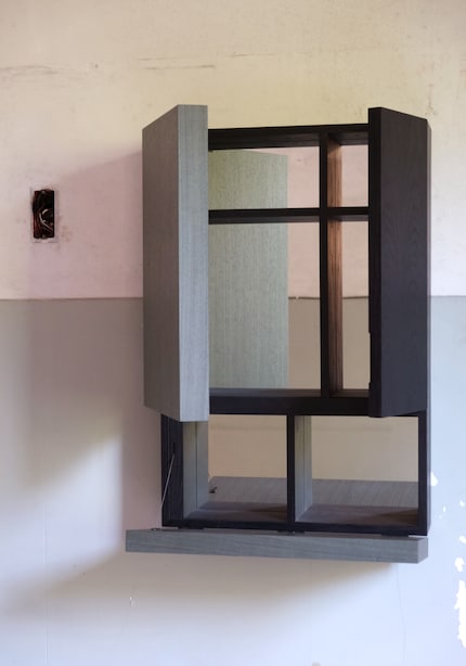 It’s made of wood with natural veneers coated in different colours.
