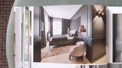 This textile wall panel frames the bed like a picture.