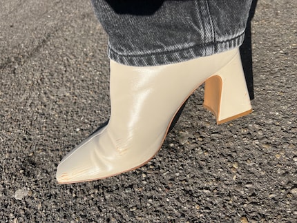 My shoes’ brown soles have left a number of dark streaks.