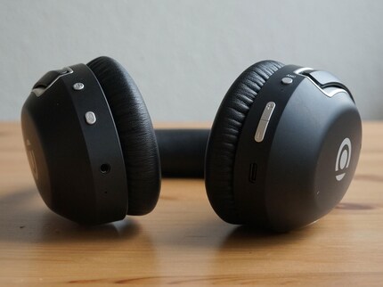 The silver buttons stick out a bit and are slightly wobbly.