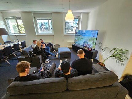 In the spectator area, people accompanying the players were able to follow the action on the large TV.