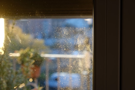 Fingerprints and graffiti adorn my window.