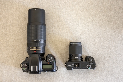 The mirror lens, with the same focal length, is much smaller.