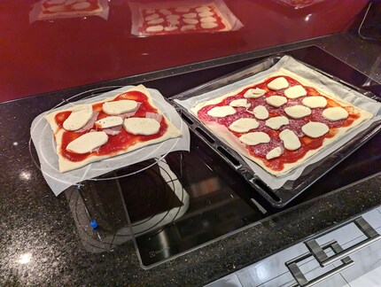 The pizza’s placed on the grill grate – unfortunately, there’s only room for one serving.