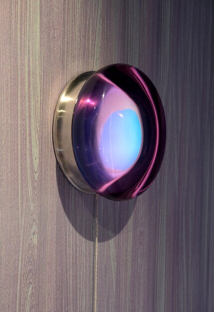 It consists of a resin dome, light filters in purple, red and cobalt and an aluminium housing.