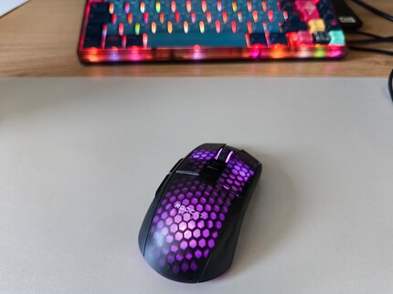 The physical aperture subtly captures my Roccat mouse.