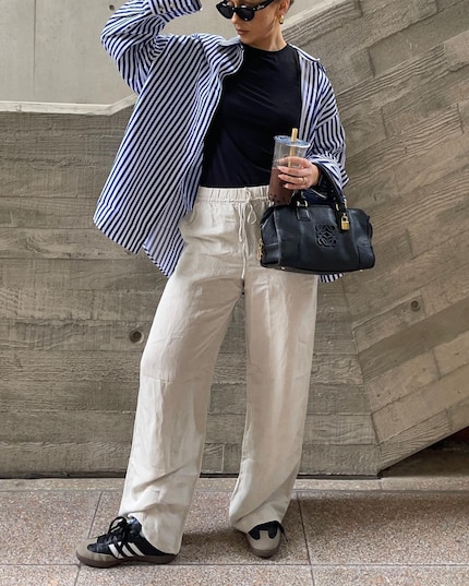 Casual combo: linen pants, t-shirt, Adidas Sambas and a loose blouse.