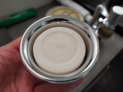 If you use shaving soap, you’ll need a container to store it in – and to mix the lather.