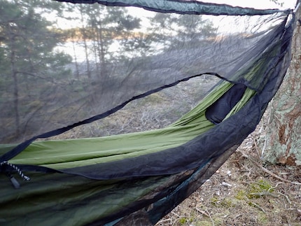 Suppleness required: getting through the mosquito net’s zip door is tight.